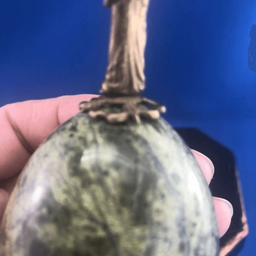 Green Marvel Egg With Brass Angel On Top