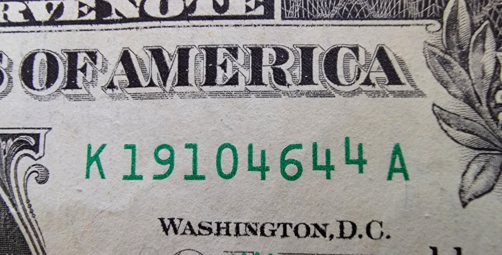 One dollar bill turn digit gas pump note