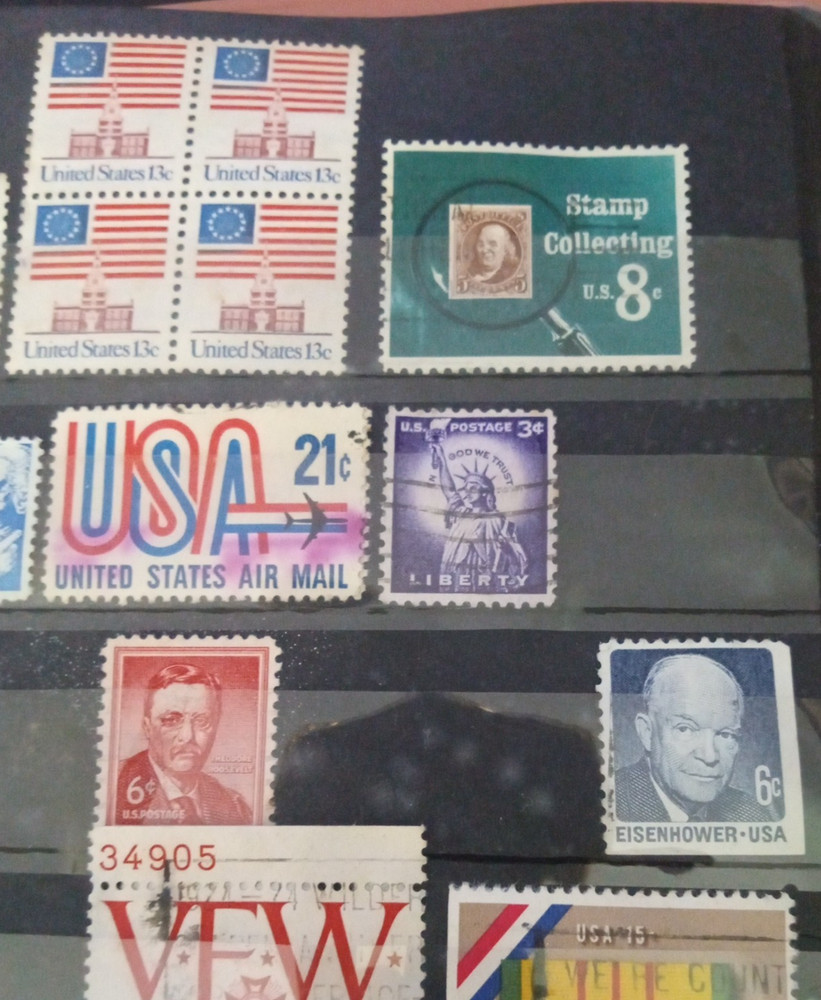 2" 3 ring binder w/ 5 pages of stamps over 100 usable stamps mostly US