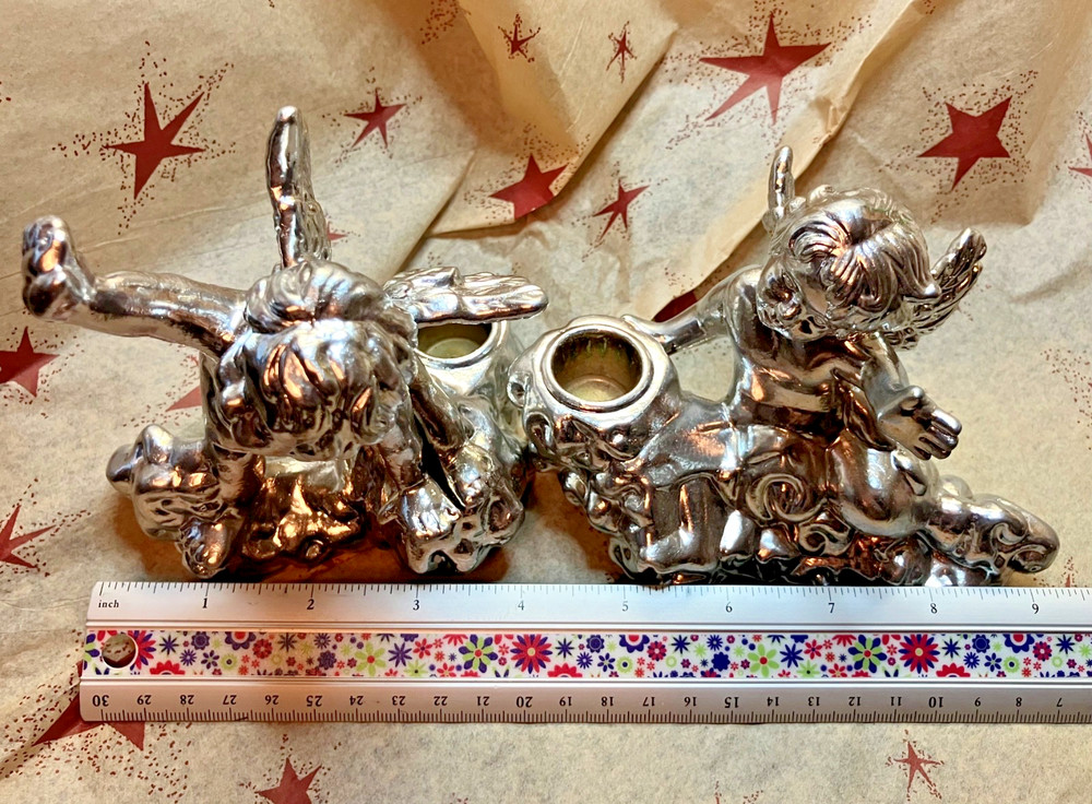 Two Silver Colored Ceramic Baby Cherub Candlestick Holders