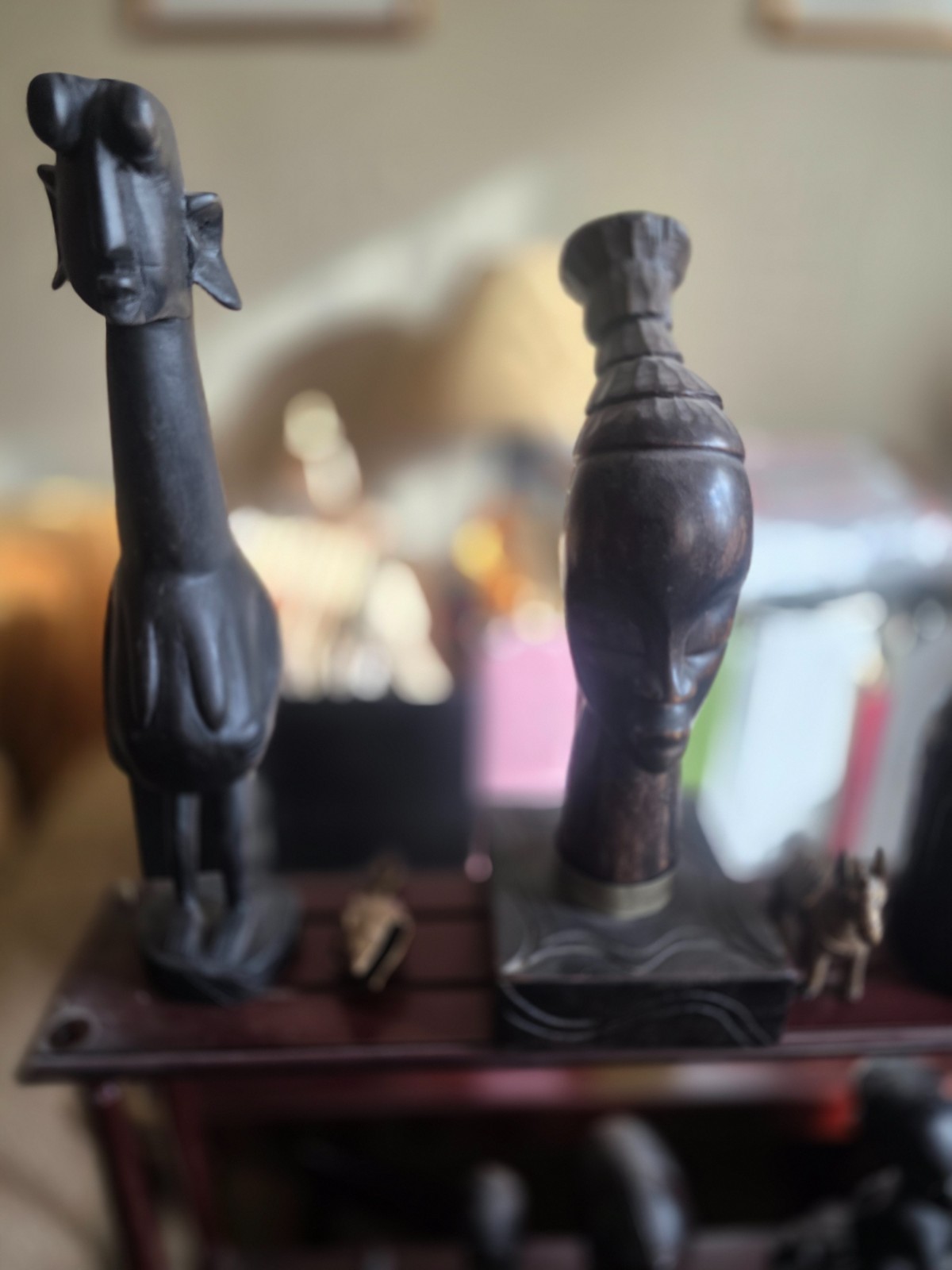 Set of carved statues from black wood, stone, bronze.