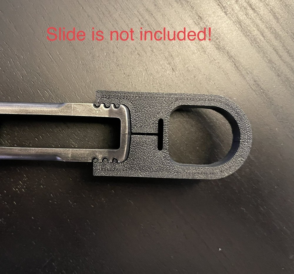 Smith & Wesson model 22A finger loop charger, slide racker.