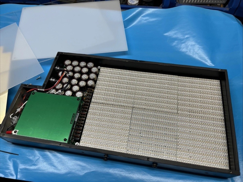 Electronic Chips Inside Testing Light Box For Perhaps Plastic Bottles Integrity.