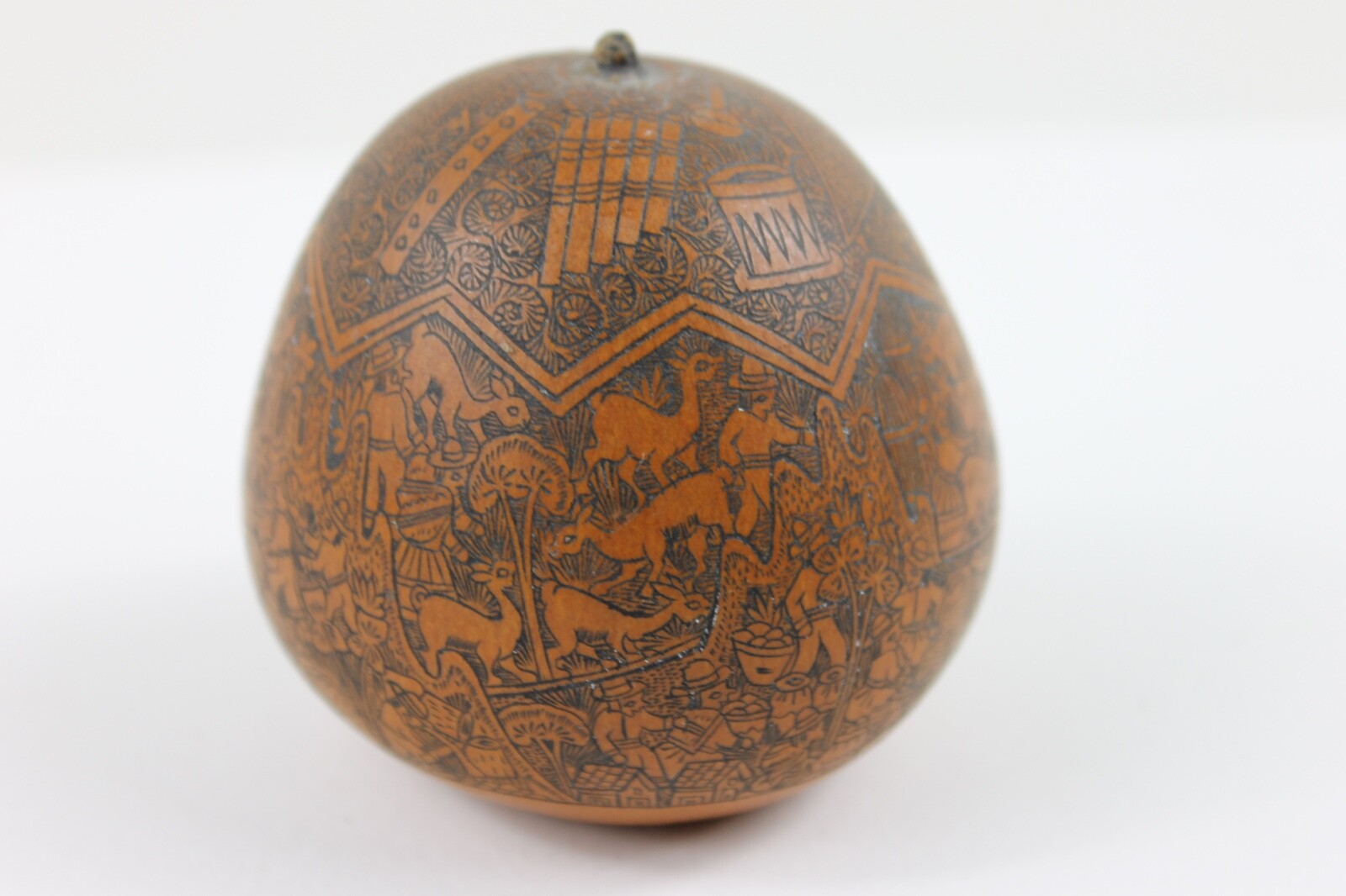 One exquisitely carved Peruvian storytelling gourd village life folk art