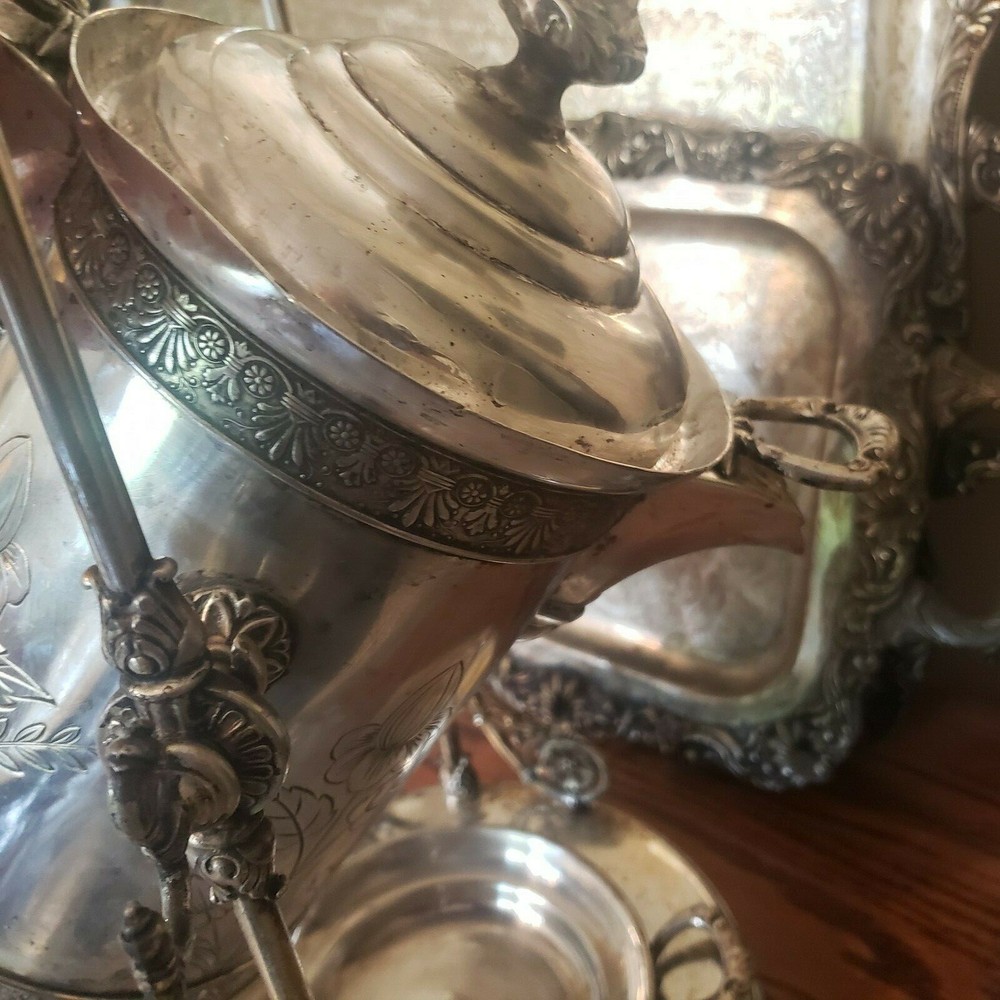 James W. Tuft silverplated tilting water pitcher. 20" tall. 
