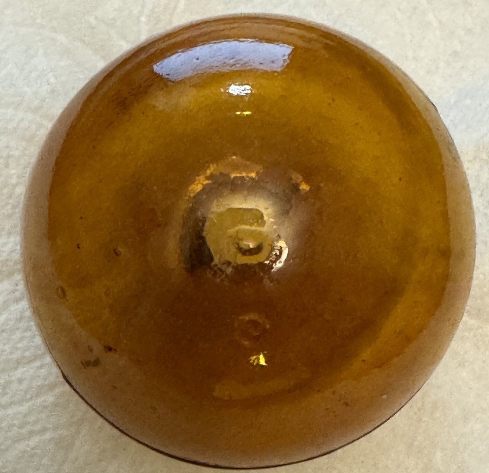 SUPER RARE ANTIQUE IRA PAINE’S FILLED AMBER GLASS TARGET/SHOOTING BALL, 2.5”