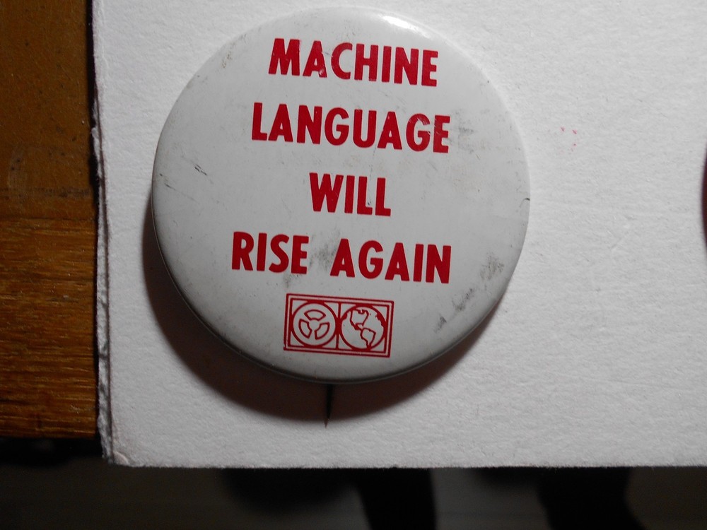 AD0006: Computerworld Machine Language Will Rise Again Pin-Back Button 2-1/4"