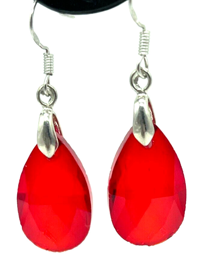 Earrings. Silver tone Large Red Crystals. Hook. 1" drop
