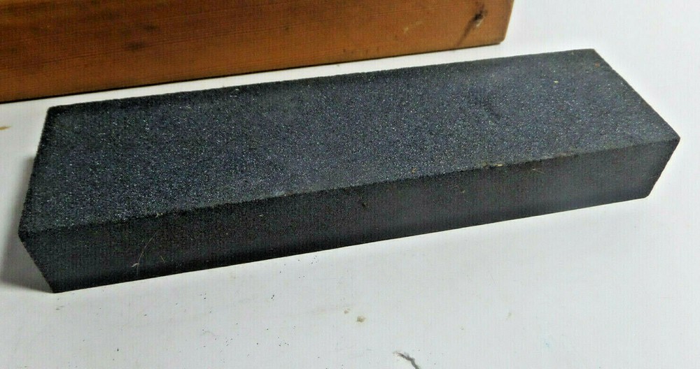 sharpening stone mounted on wood base