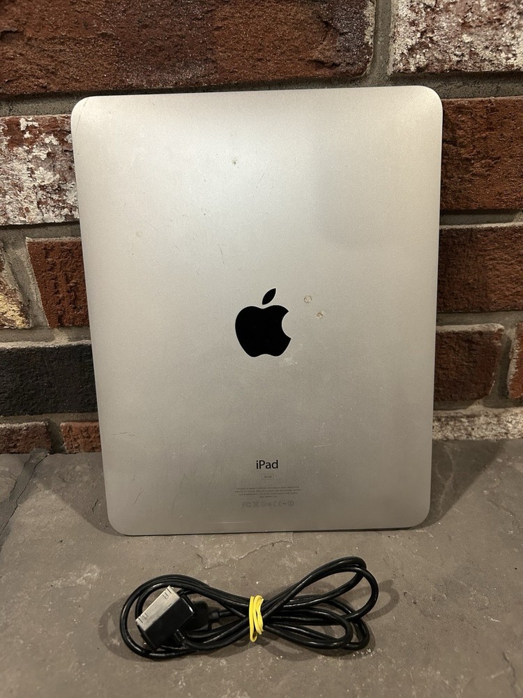 first-generation Apple iPad with a 30-pin charging cable