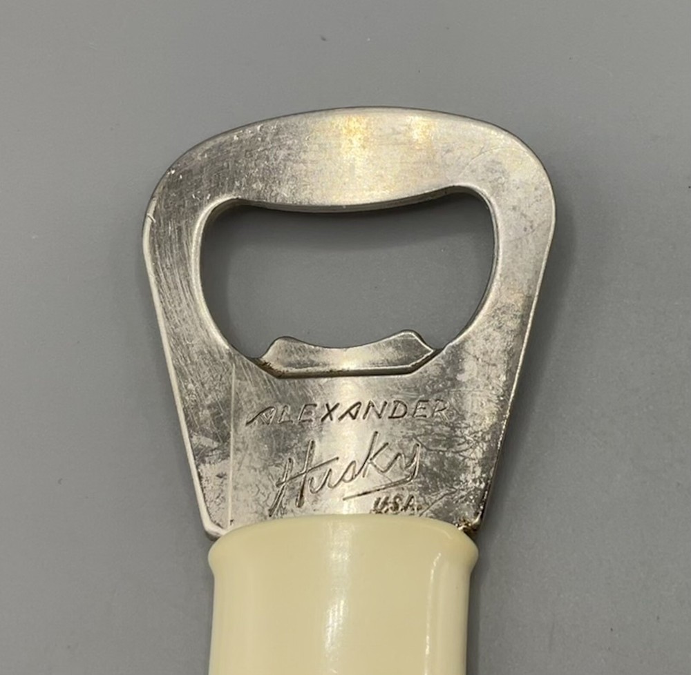Vtg Alexander Husky Multi-Function Bottle Opener/Tab Lifter Advertising Sample