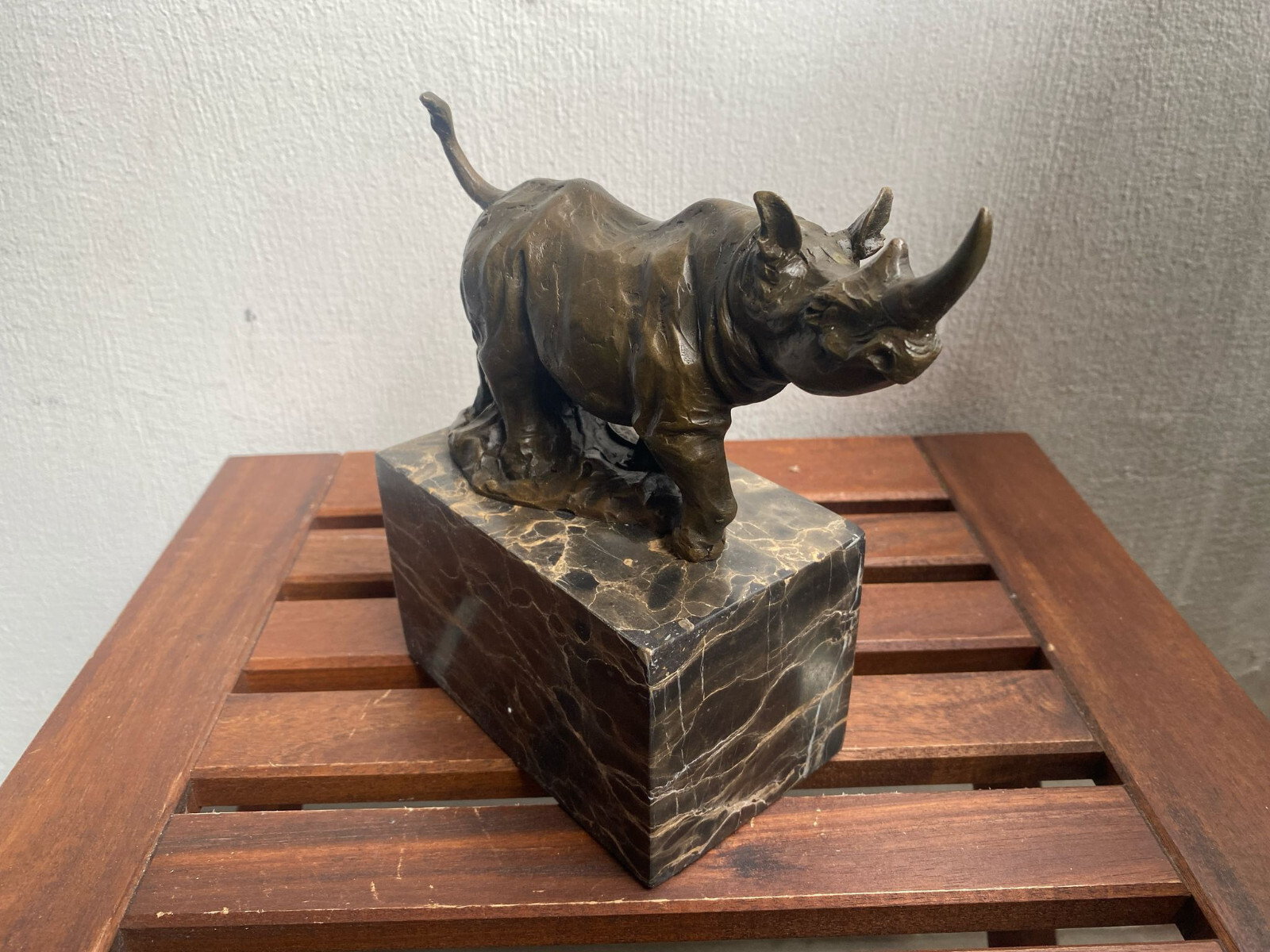 Bronze sculpture Walking Rhinoceros on a black marble base after Milo