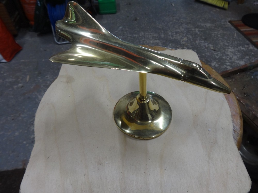 A Brass Mirage Jet Fighter.