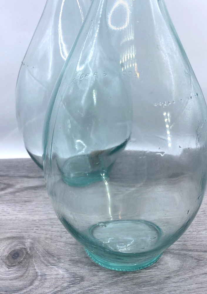 Two old wine bottles - 1 Cork inside - Label Residue