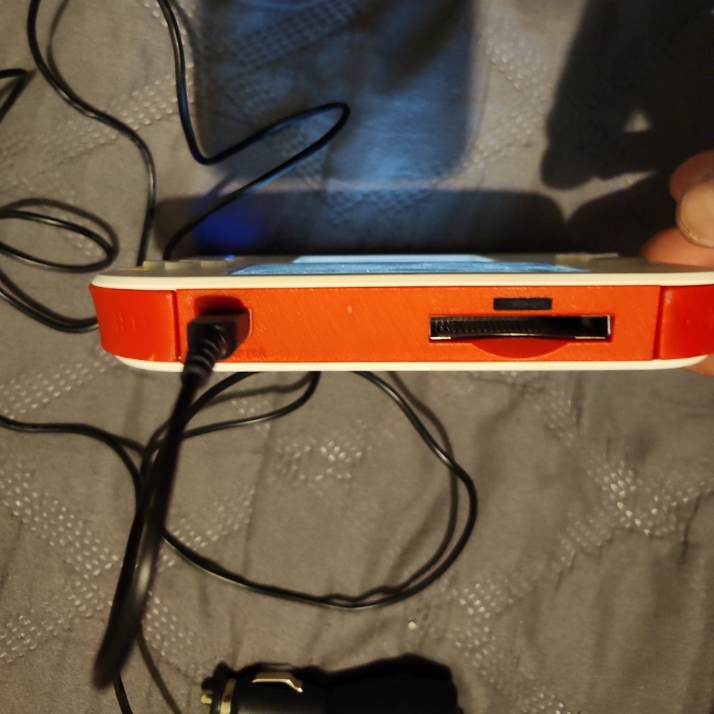 nintendo 2ds red white console with car charger