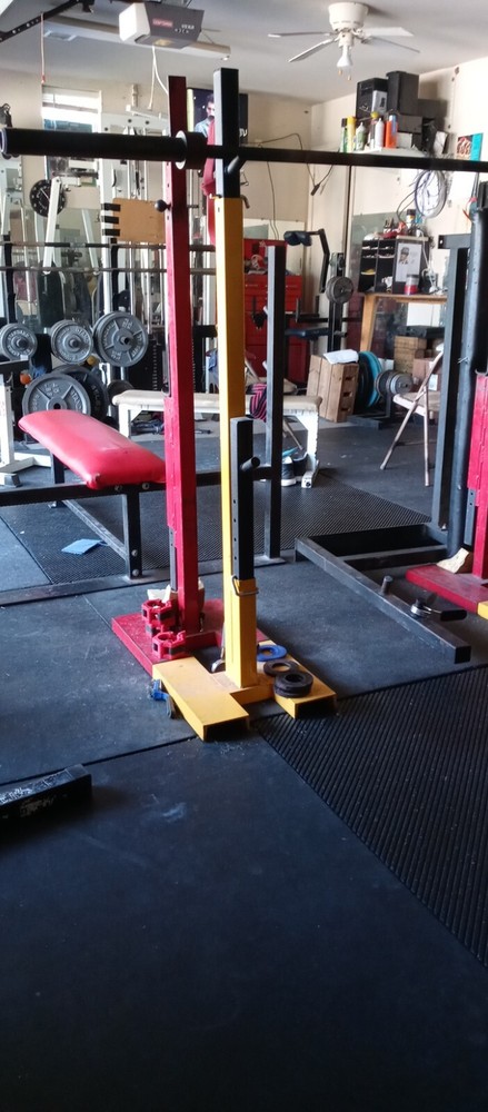 Used Pioneer adjustable open squat racks