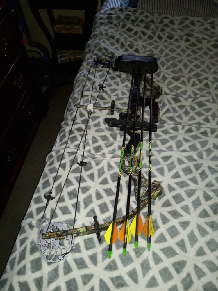 tomkat bowtech compound bow with aftermarket scope