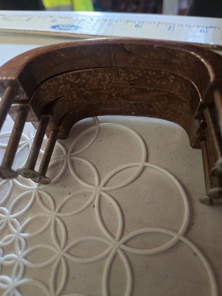 Antique copper metal door pulls with hammered texture finish.