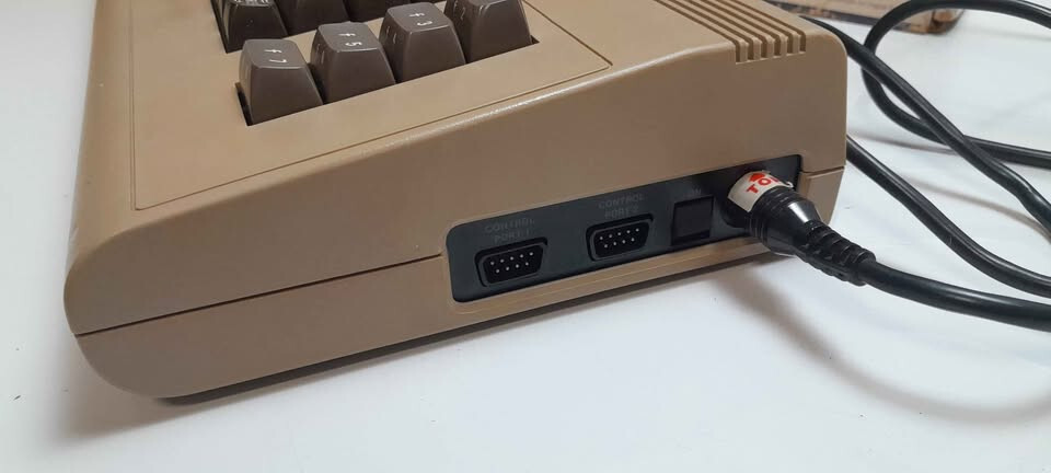 Vintage Commodore 64 computer in box, manuals and programs package