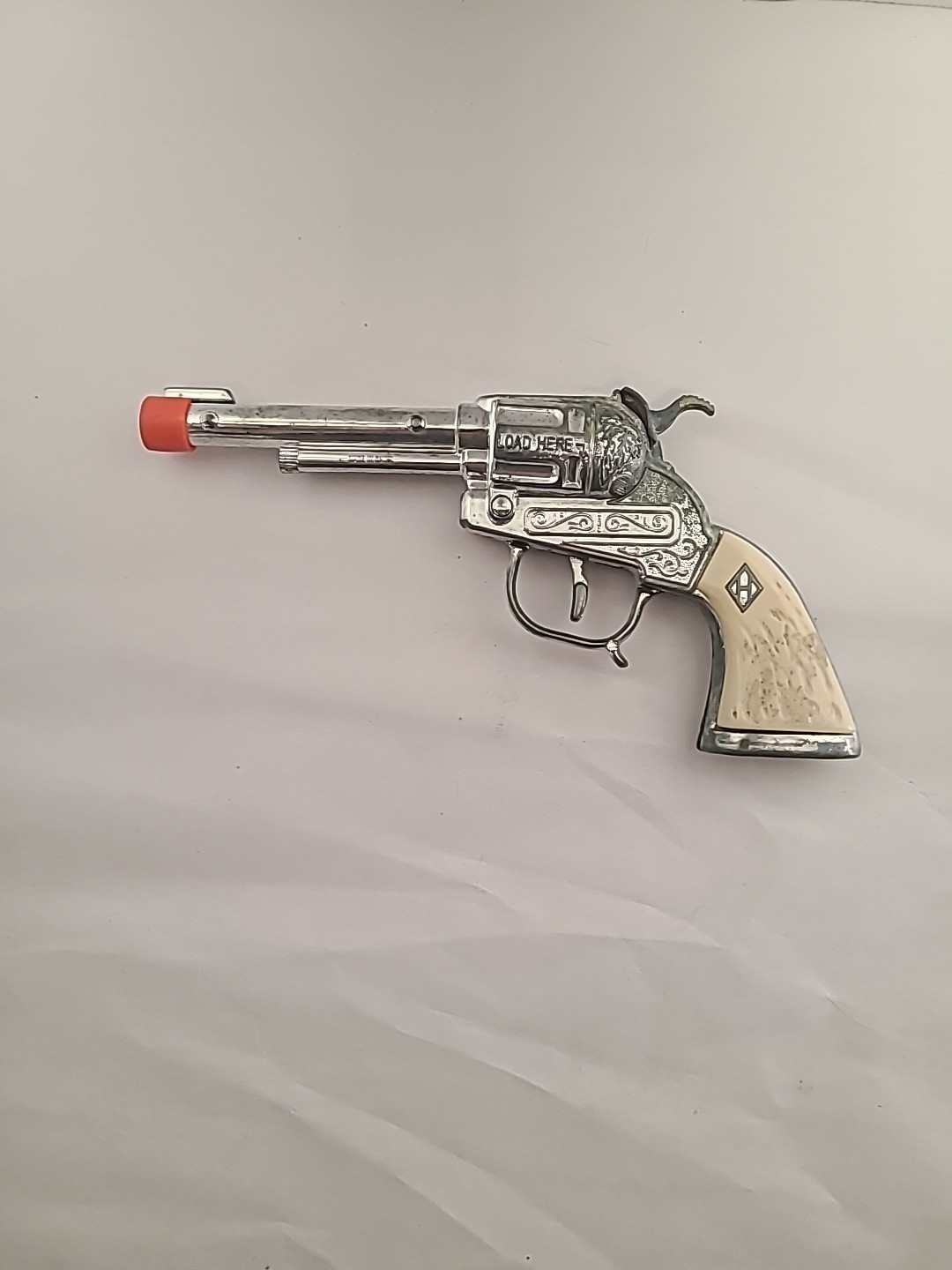 Vintage Halco Cowboy Die Cast Toy Cap Gun with Orange Plug & White Grip Handle—