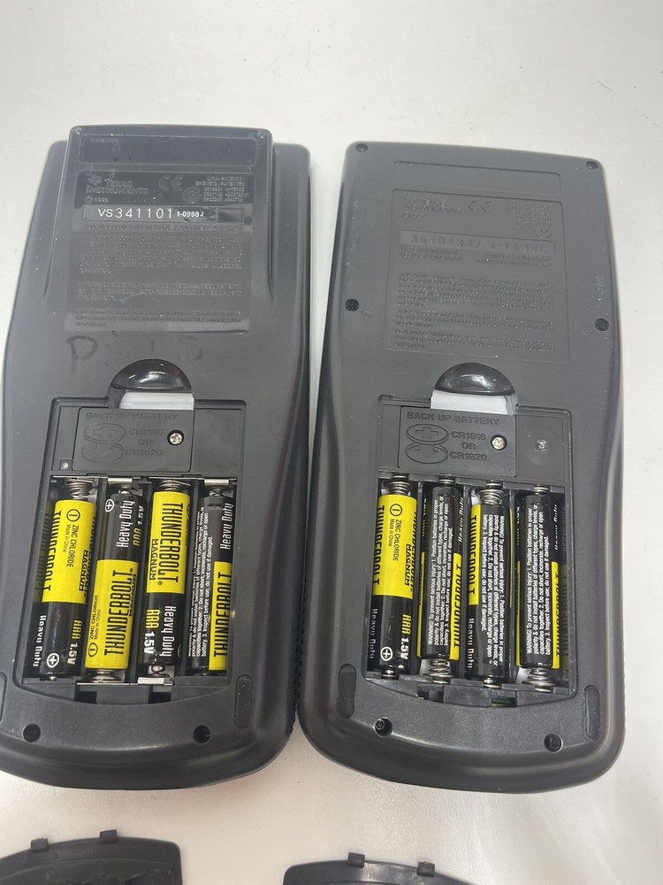 2 Texas Instruments TI-83 Graphing Calculators With Covers