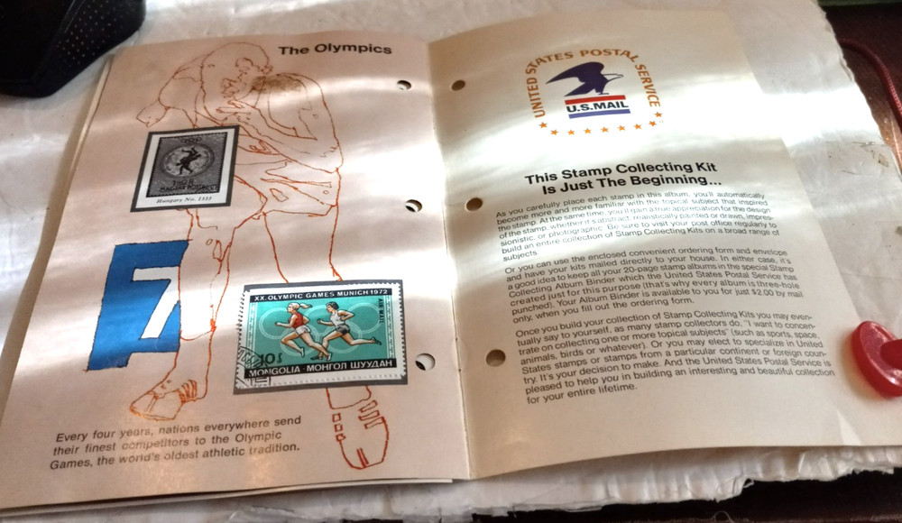 THE WORLD OF SPORTS STAMP ALBUM 1974 USPS COUNTRY & OLYMPICS STAMPS INCLUDED
