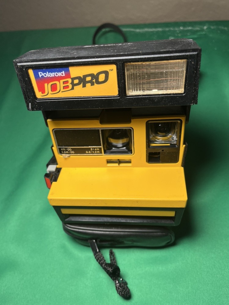 Vintage Polaroid Camera With Carrying Strap