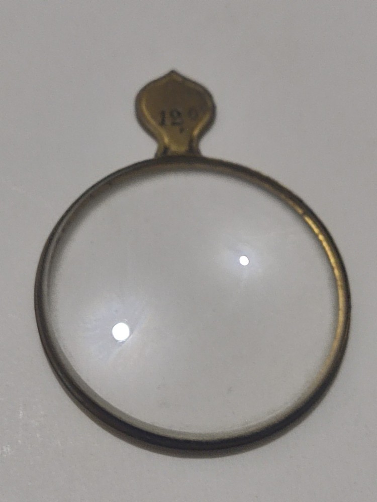 Antique magnifying glass.