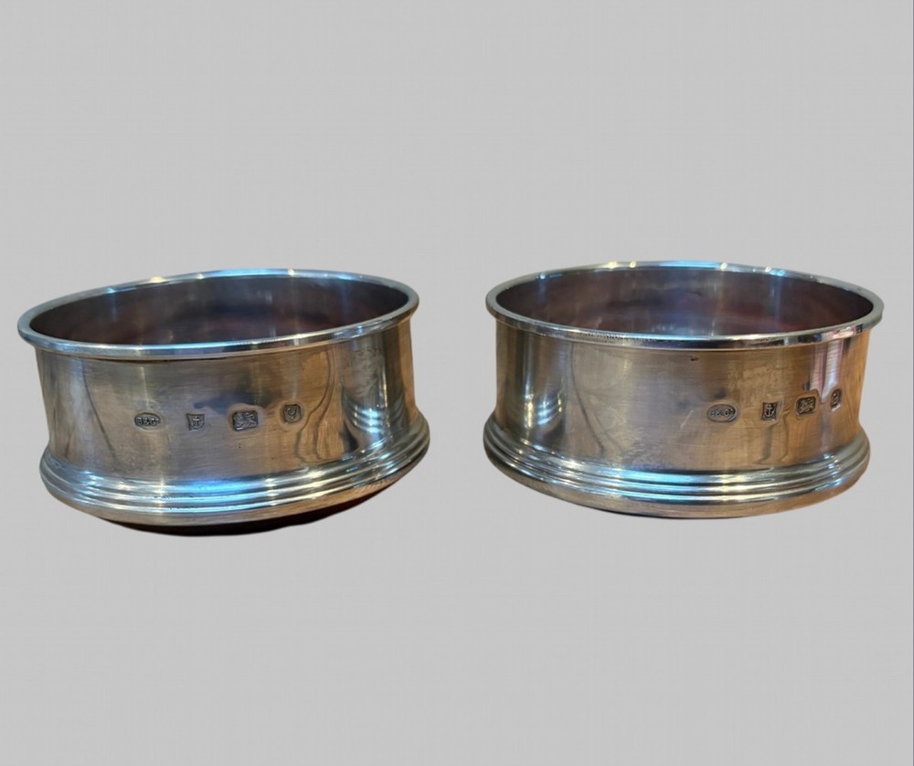 A Excellent Pair of Silver Wine Bottle Coasters