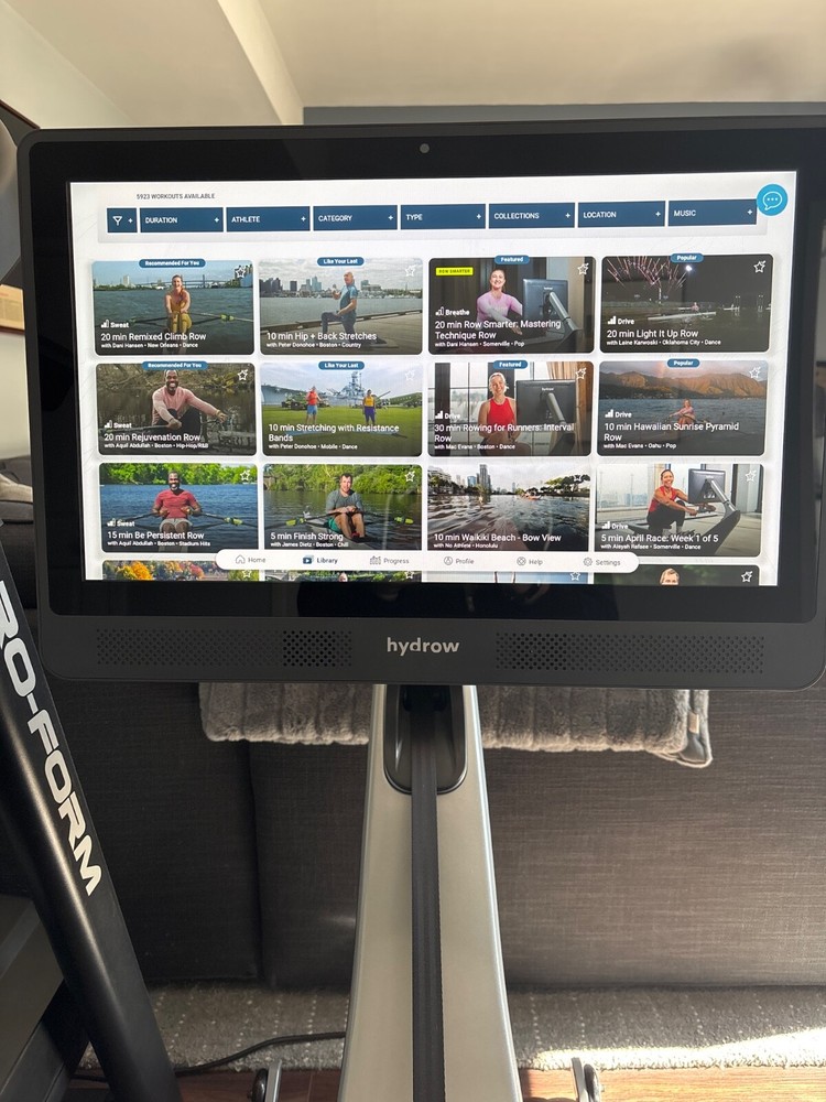 Pro Rowing Machine with Immersive 22" HD Rotating Screen - Stows Upright |