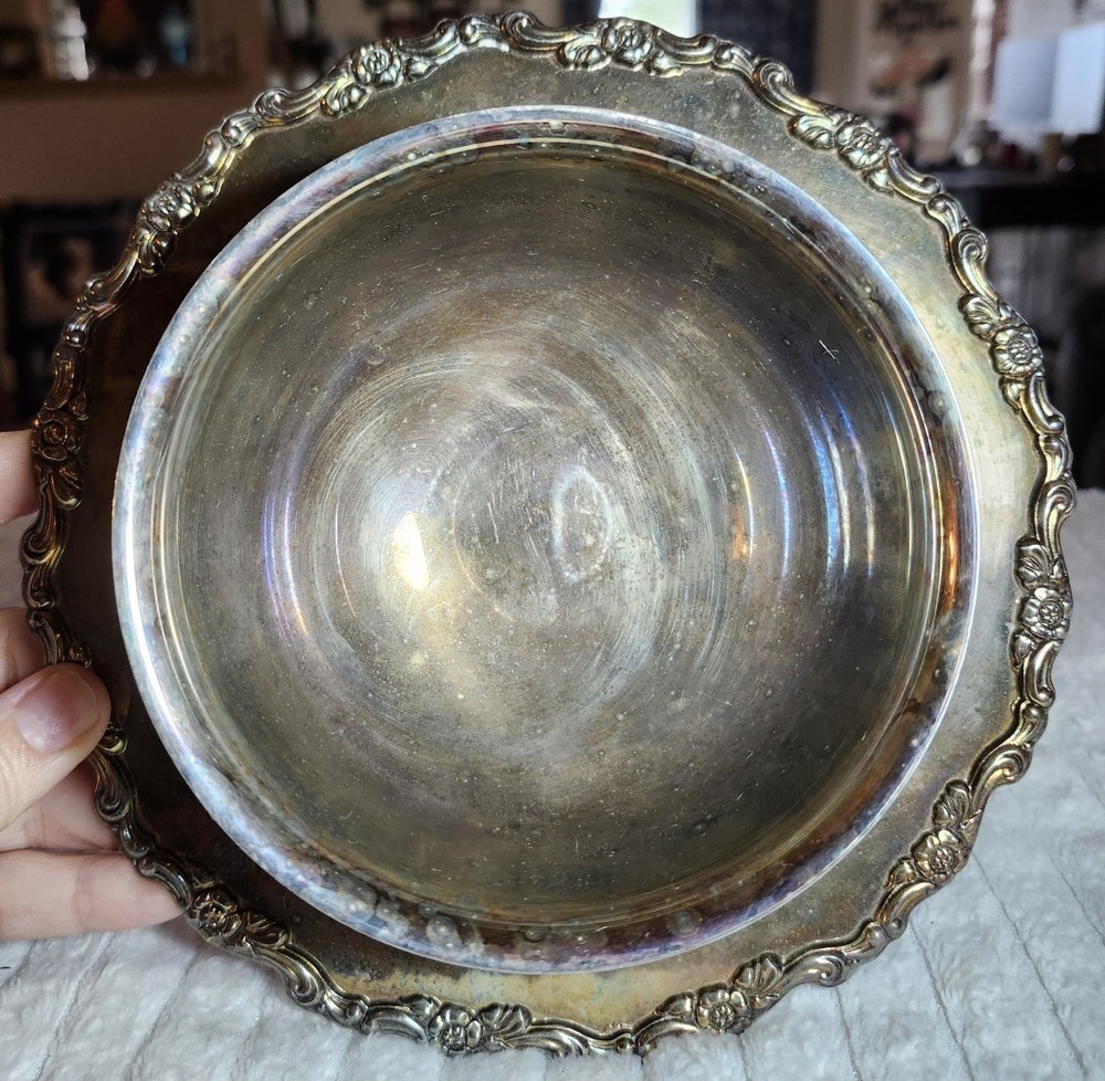 Silver-plated ornate bowl with attached underplate, possibly Oneida or Wallace.