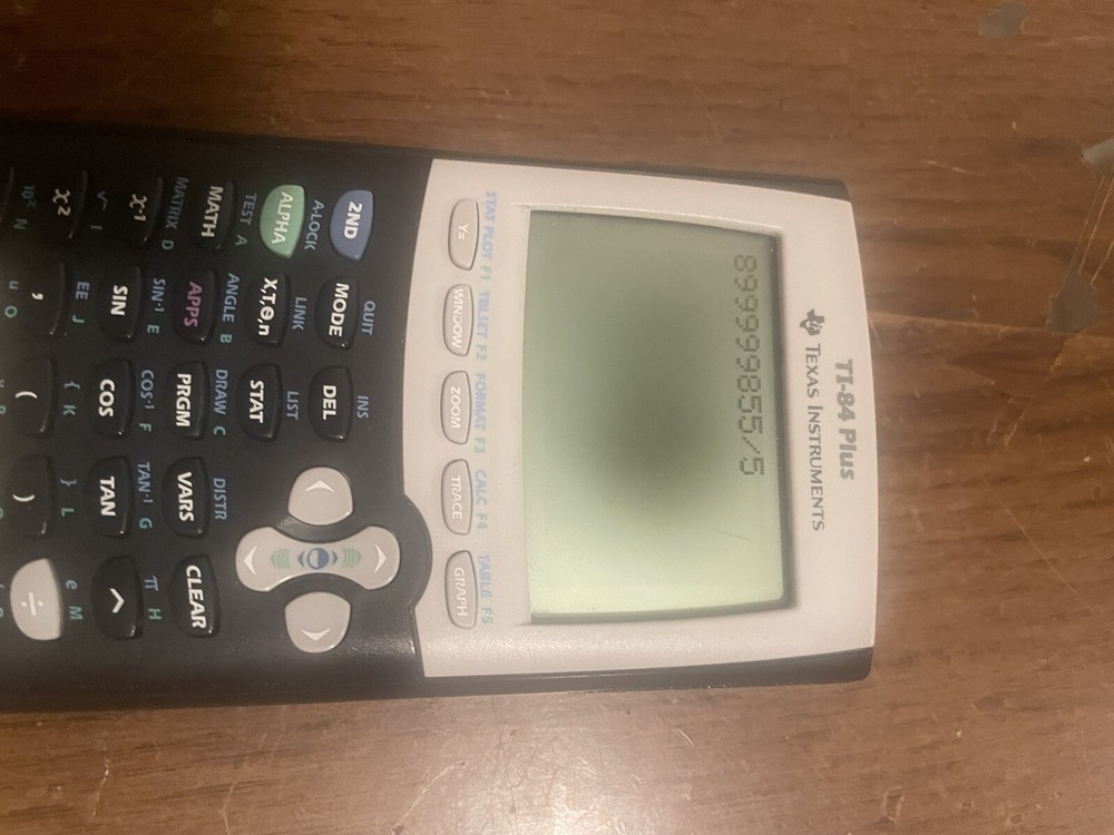 Texas Instruments TI-84 Plus Graphing Yellow and Black Calculator Read De