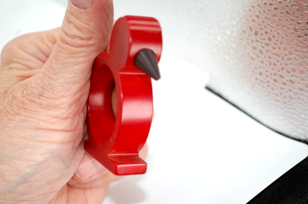 catalin bakelite napkin ring red birt black beak