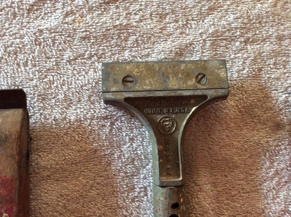 Three red Devil scraper tools