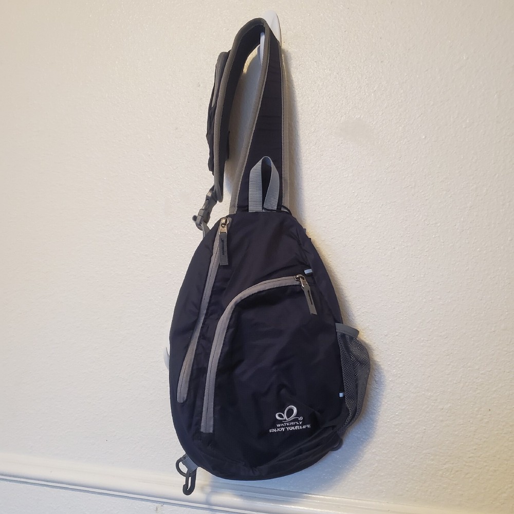 Waterfly Sling Pack - Black Gray Adjustable Strap Pockets Zippered NWT
