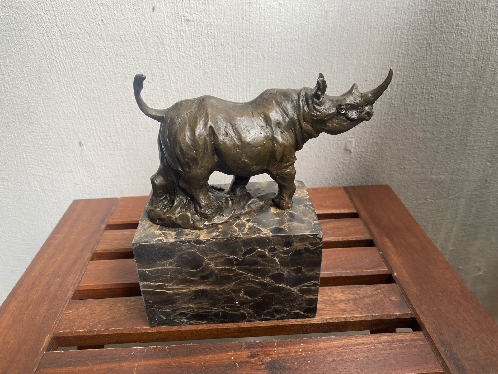 Bronze sculpture Walking Rhinoceros on a black marble base after Milo