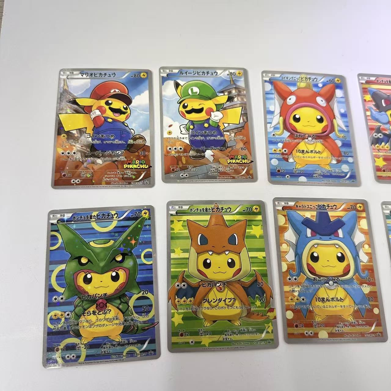 POKEMON PIKACHU PONCHO CHARIZARD MARIO LUIGI RAYQUAZA COMPLETE SET 8 Card