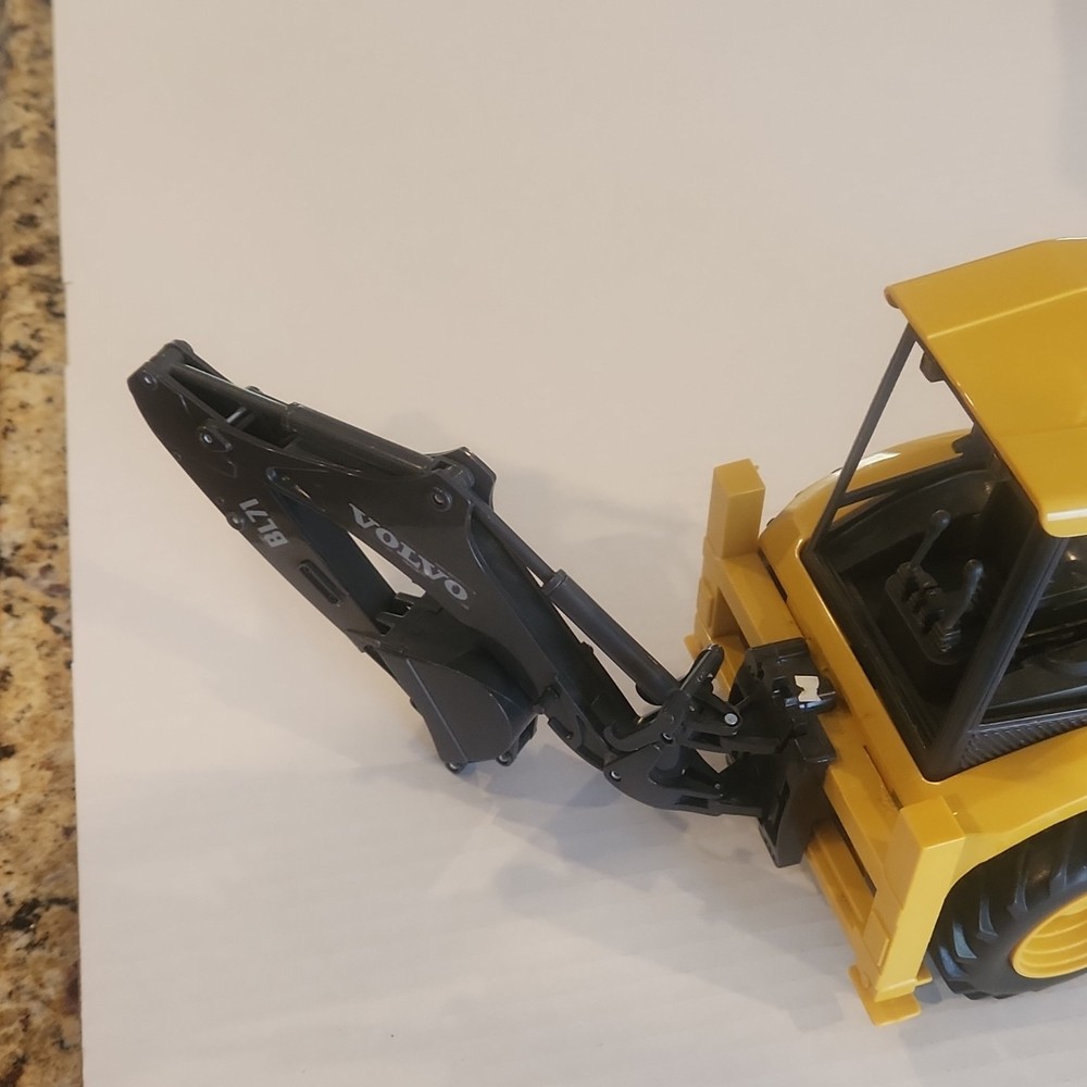 Volvo BL71 Backhoe Loader Plastic Toy Model Yellow Black