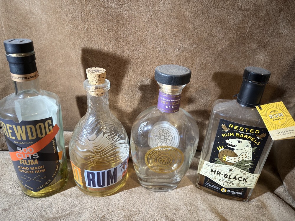 4 EMPTY RUM BOTTLES MIXTURE