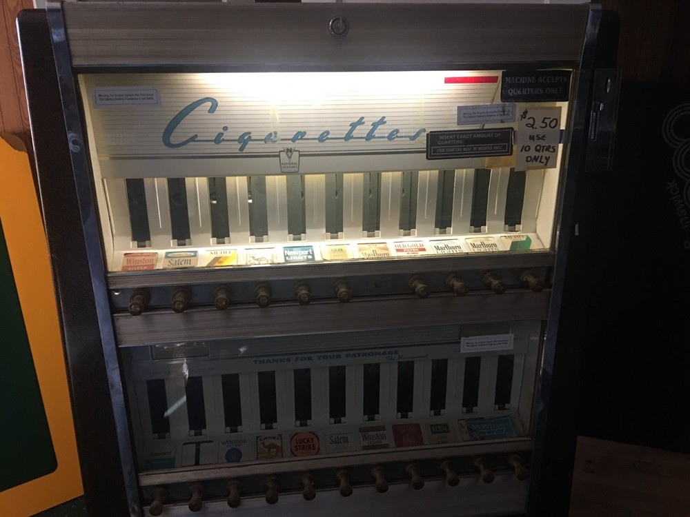 2- antique cigarette vending machine