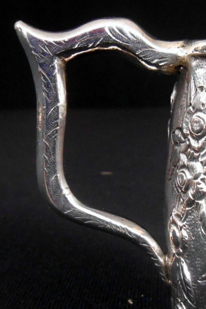 A solid silver child's mug, architectural repousse, S. Kirk & Son, 11 oz, c.1860