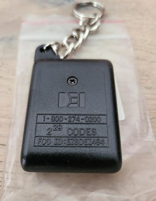Directed Electronics (DEI) Remote Control 484T 4-button Red LED Indicator