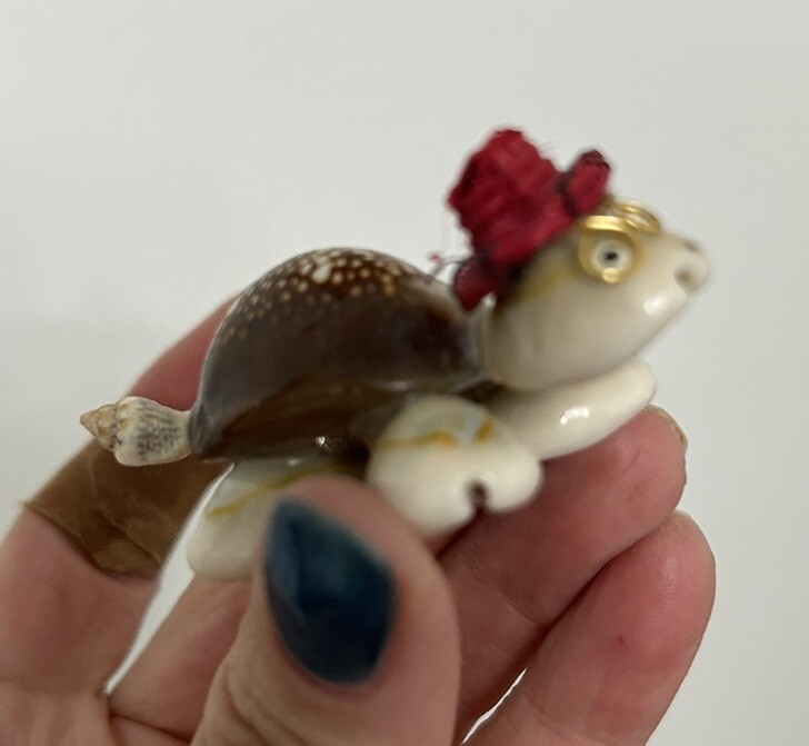 Vintage Turtle Made Of Shells With Red Hat