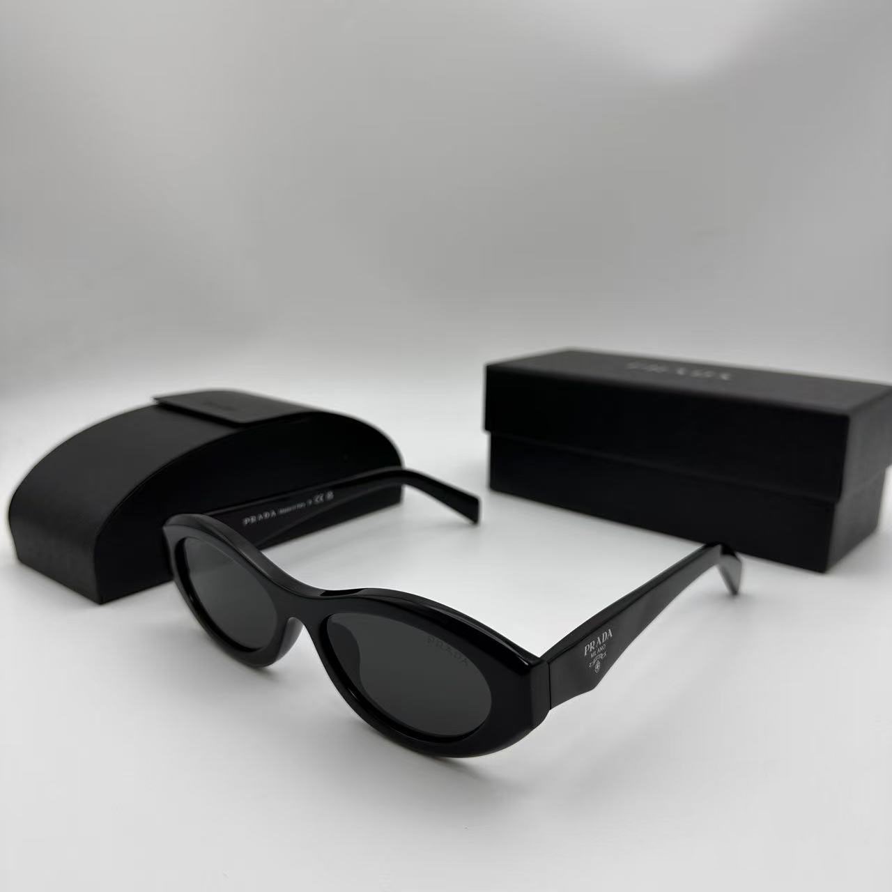 PRADA SPR26Z Black Sunglasses Polished Black Gray Tint Silver Logo