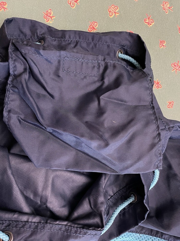 Eddie Bauer navy and teal drawstring bag with backpack straps