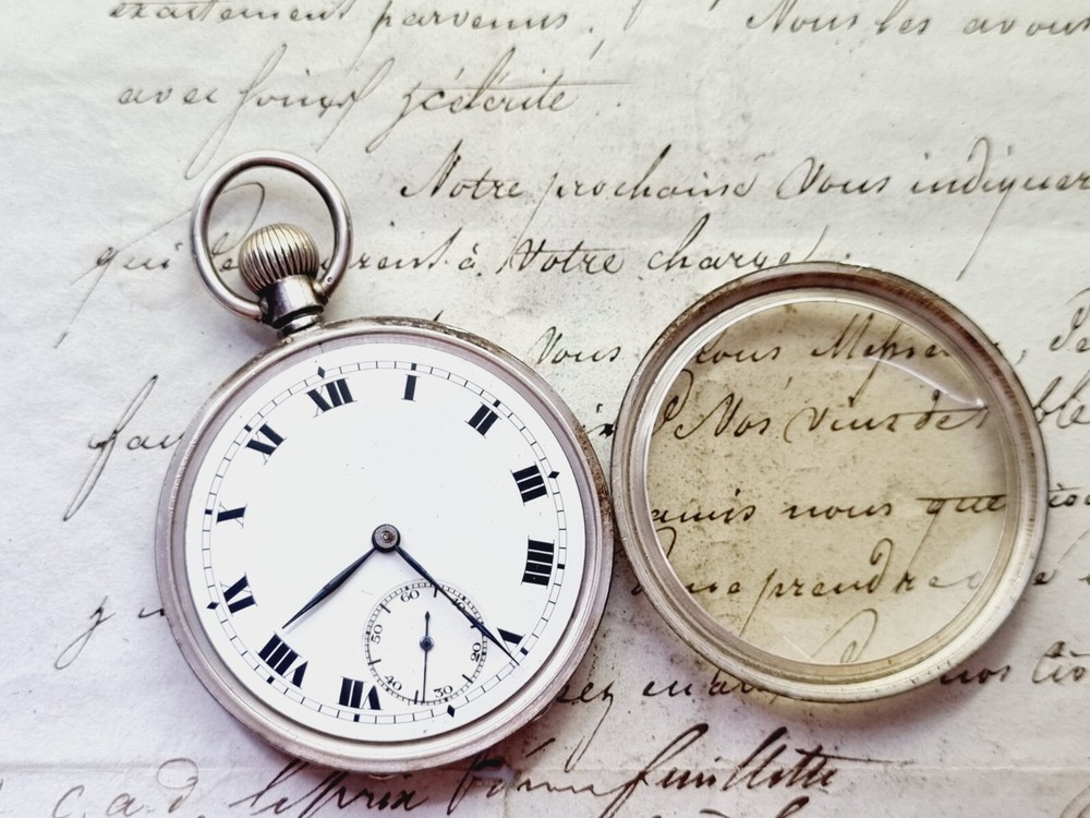 silver open face pocket watch