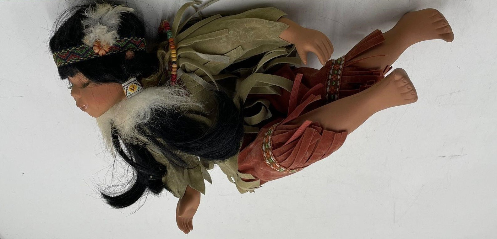 Vintage Native American Girl Doll in Kissing Expression Closed Eyes Sitting Pose