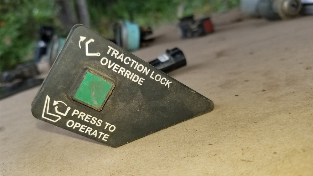 Bobcat Traction lock override button 6667905