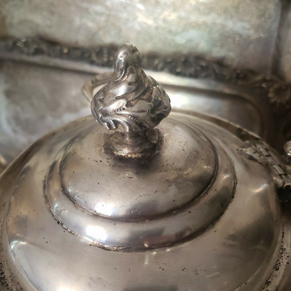 James W. Tuft silverplated tilting water pitcher. 20" tall. 
