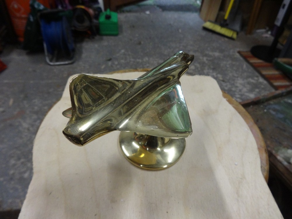 A Brass Mirage Jet Fighter.